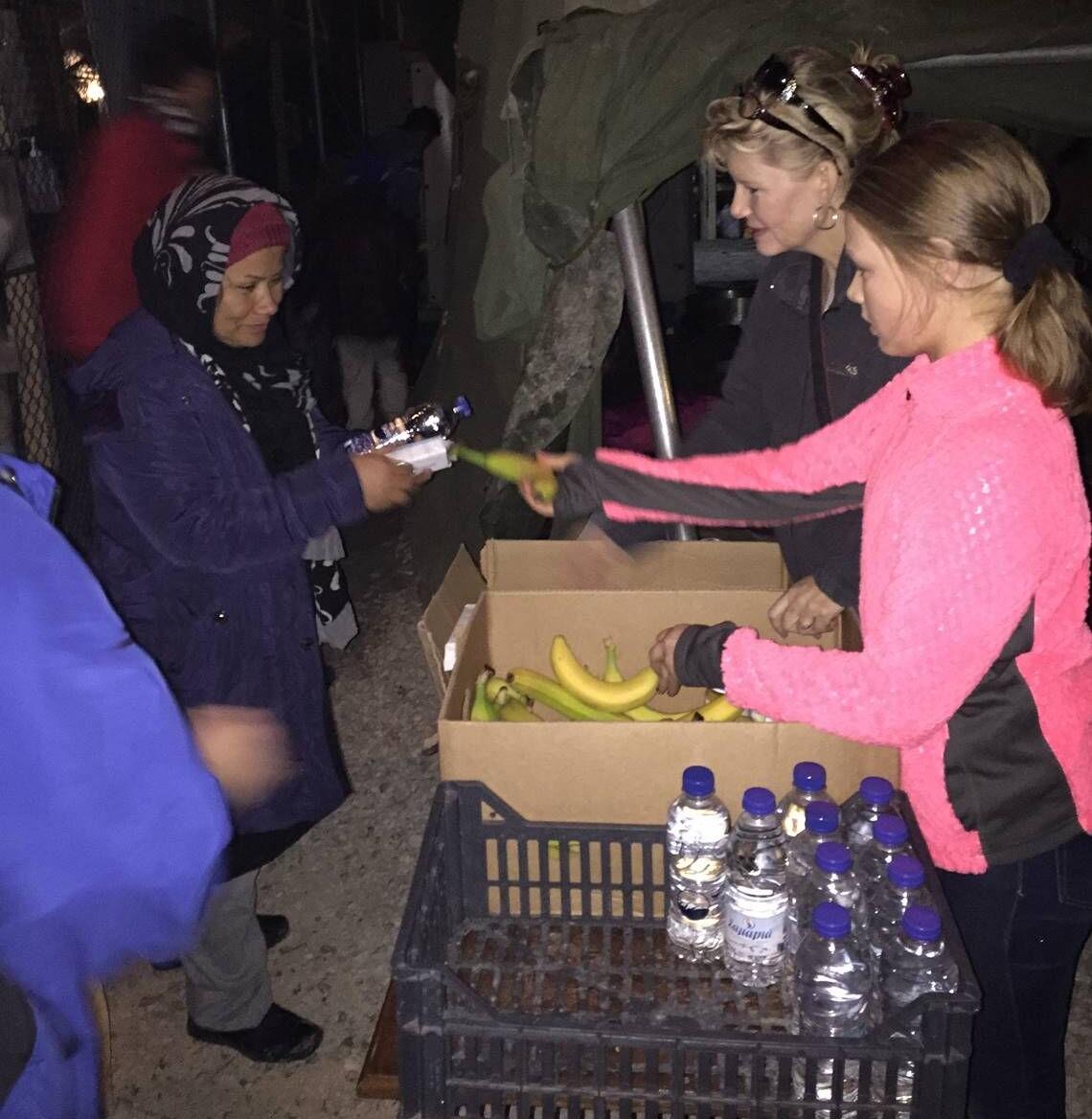 Debbie and daughter serving refugee (1).jpg